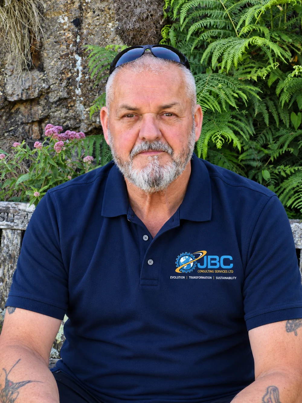 John Braines, Founder and Managing Director of JBC Consulting Services Ltd, wearing a JBC-branded polo shirt outdoors